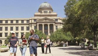 students-in-front-of-the-academic-building-on-the-texas-a-m-university-campus_slide
